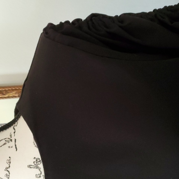 May May, black top with large, gathered sleeves. - Picture 4 of 7